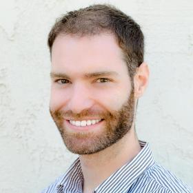 Headshot of Logan Fink with a white background